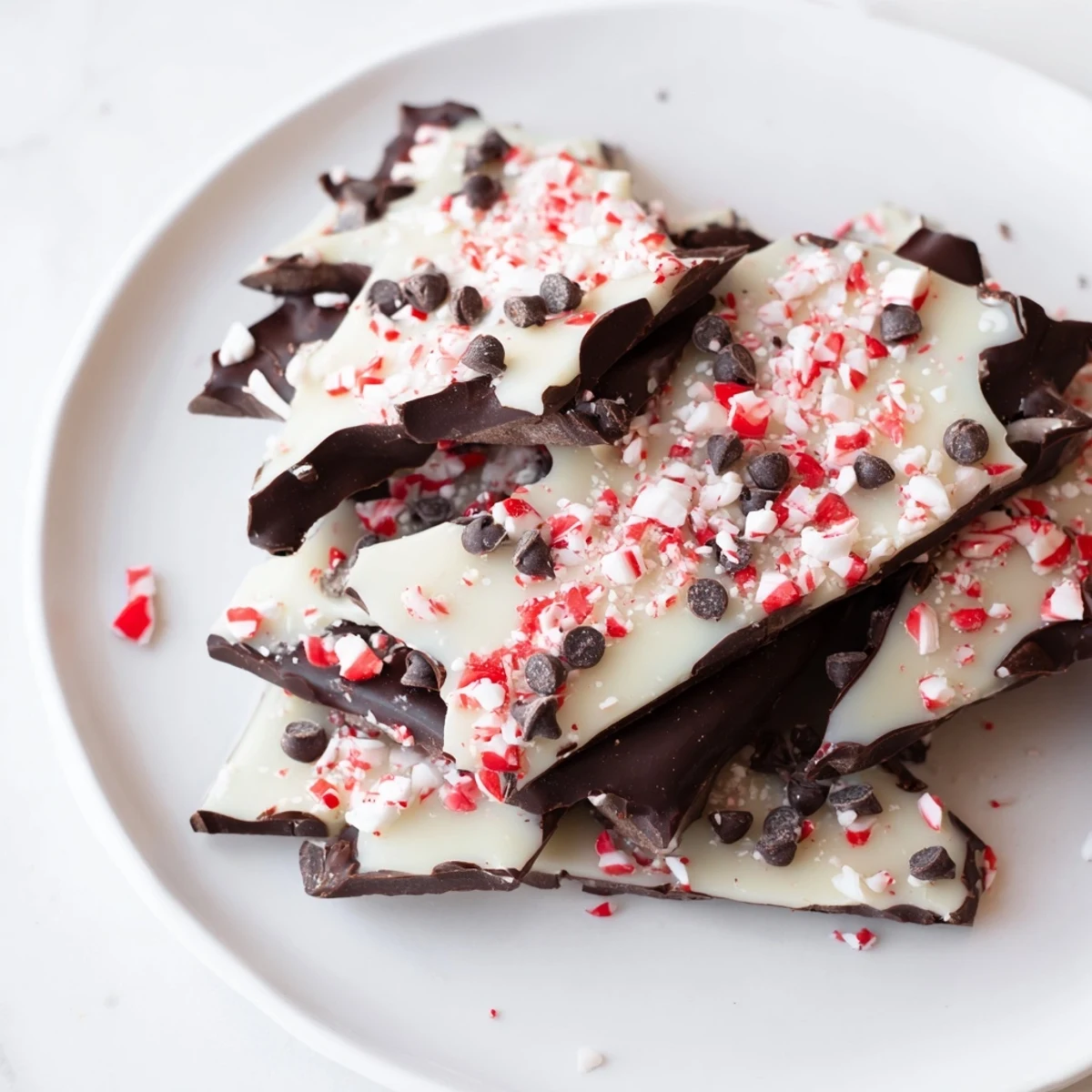 A close-up shot of the colorful, glistening Peppermint Bark shards, perfect for sharing.