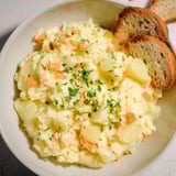 A close-up of Creamy Garlic Potato Soup reveals its smooth, creamy texture, ready to warm you.