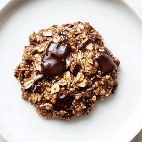 Warm chocolate oatmeal breakfast cookies, a satisfying, naturally sweet, delicious, grab-and-go meal.