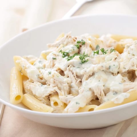 This delicious Tinis Creamy Chicken Pasta features tender chicken in a garlic Parmesan cream sauce.