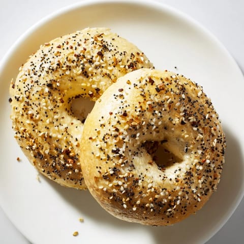 A close-up of fluffy Everything Bagel Yogurt Bagels, perfectly shaped and ready for a delicious breakfast.
