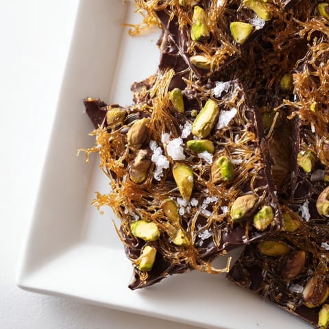 This homemade Kataifi Chocolate Crunch Bark features crispy kataifi layered in rich, dark chocolate with pistachios.