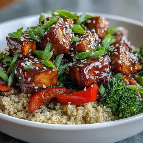 Fluffy quinoa and crisp stir-fried vegetables drenched in homemade teriyaki sauce, ready to serve.