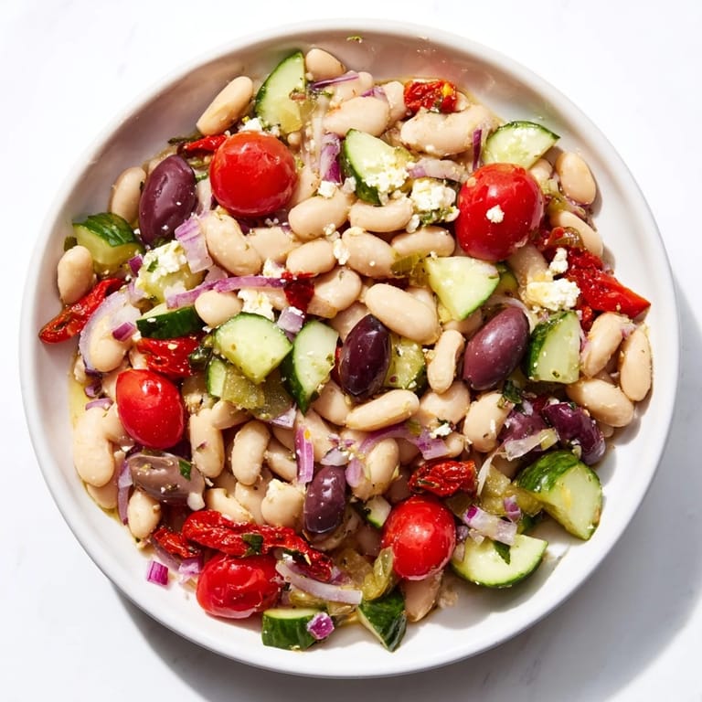 Creamy feta tops this refreshing Mediterranean White Bean Salad, tossed in a bright lemon dressing.