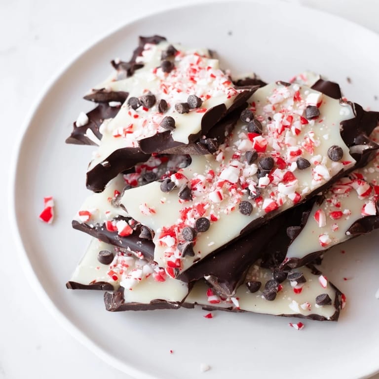 A close-up shot of the colorful, glistening Peppermint Bark shards, perfect for sharing.
