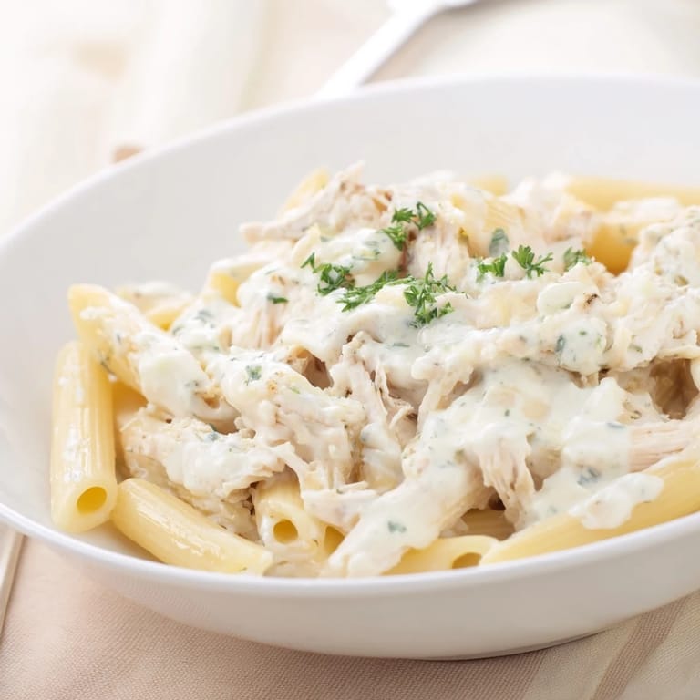 This delicious Tinis Creamy Chicken Pasta features tender chicken in a garlic Parmesan cream sauce.