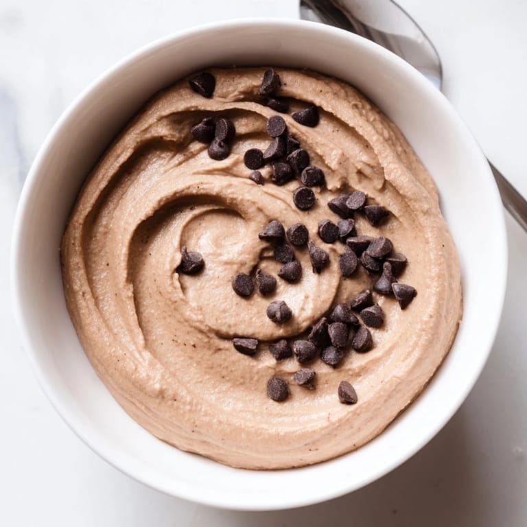 A close-up shot of creamy, decadent chocolate hummus, perfect for a healthy snack or dessert.