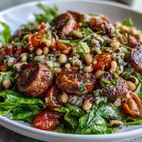 Freshly prepared Hoppin John Style Black-Eyed Pea Salad with sliced turkey sausage, diced bell peppers, and a creamy mustard dressing tossed with tarragon.